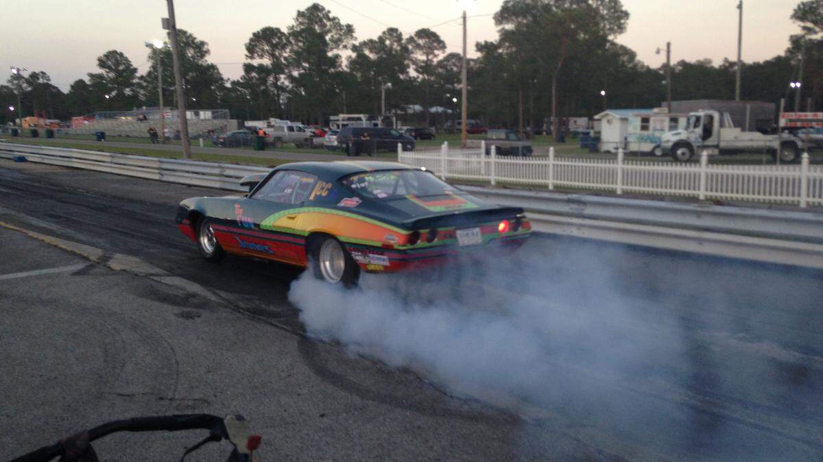 CHRISTOPHER DEARMAN/SPECIAL TO THE SUN HERALDA dragster getting its tires sticky for better traction in the 'burnout box'