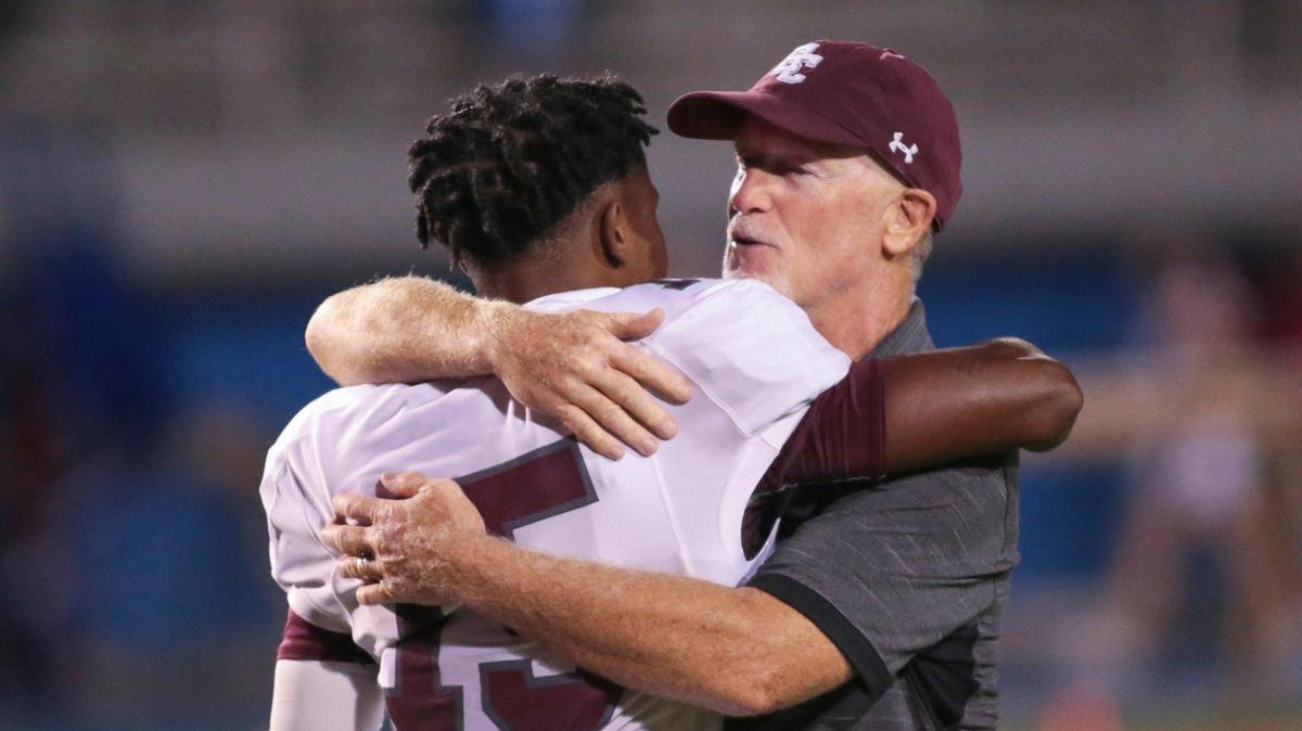 East Central quarterback Deuce Hugger (15) and East Central head coach Eric Collins share a moment after the Hornets’ victory during the game between East Central and Pascagoula in Pascagoula on Friday, October 23, 2020.