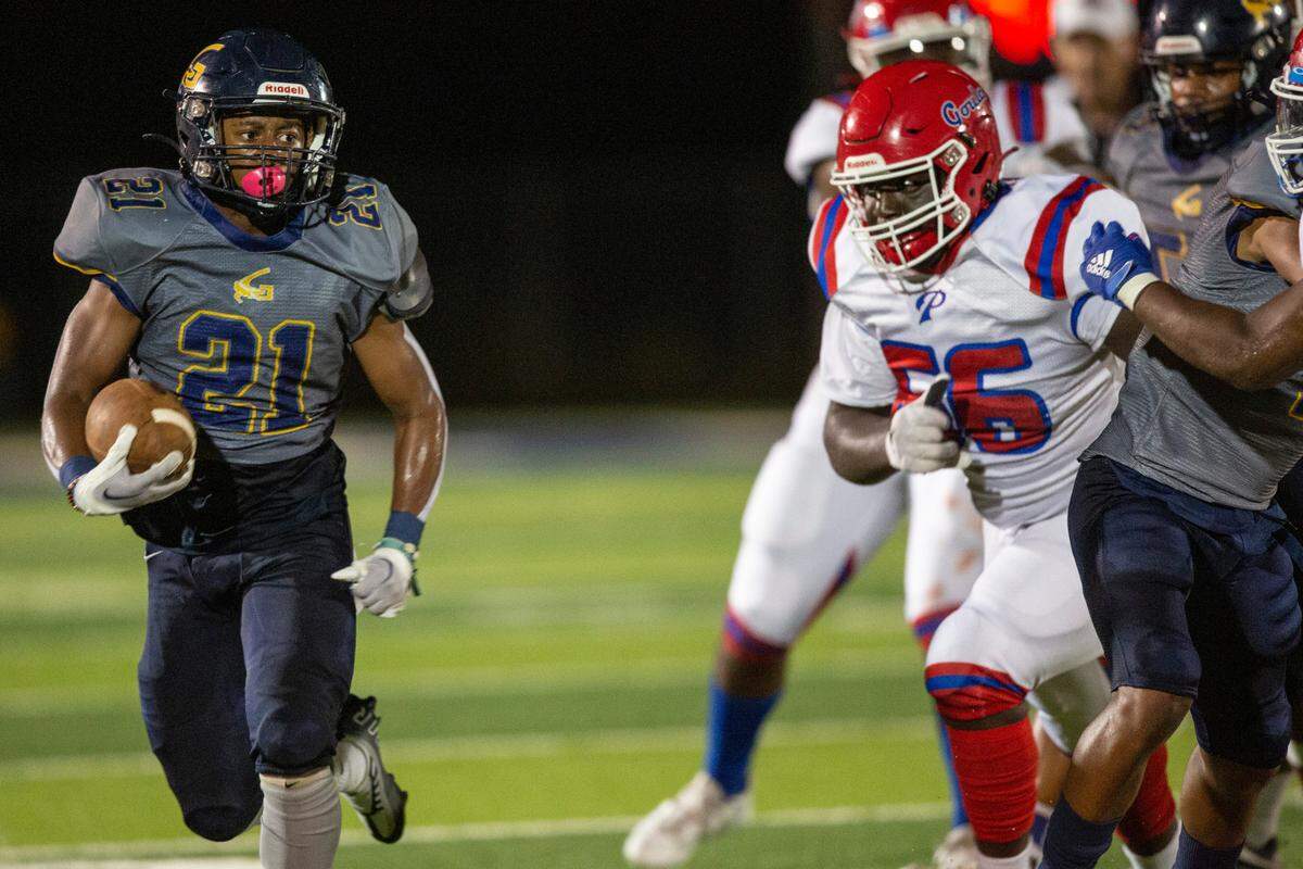 Gautier’s Marcus Cunningham runs the ball up the field during a game against Pascagoula at Gautier High School in Gautier on Friday, Sept. 2, 2022.