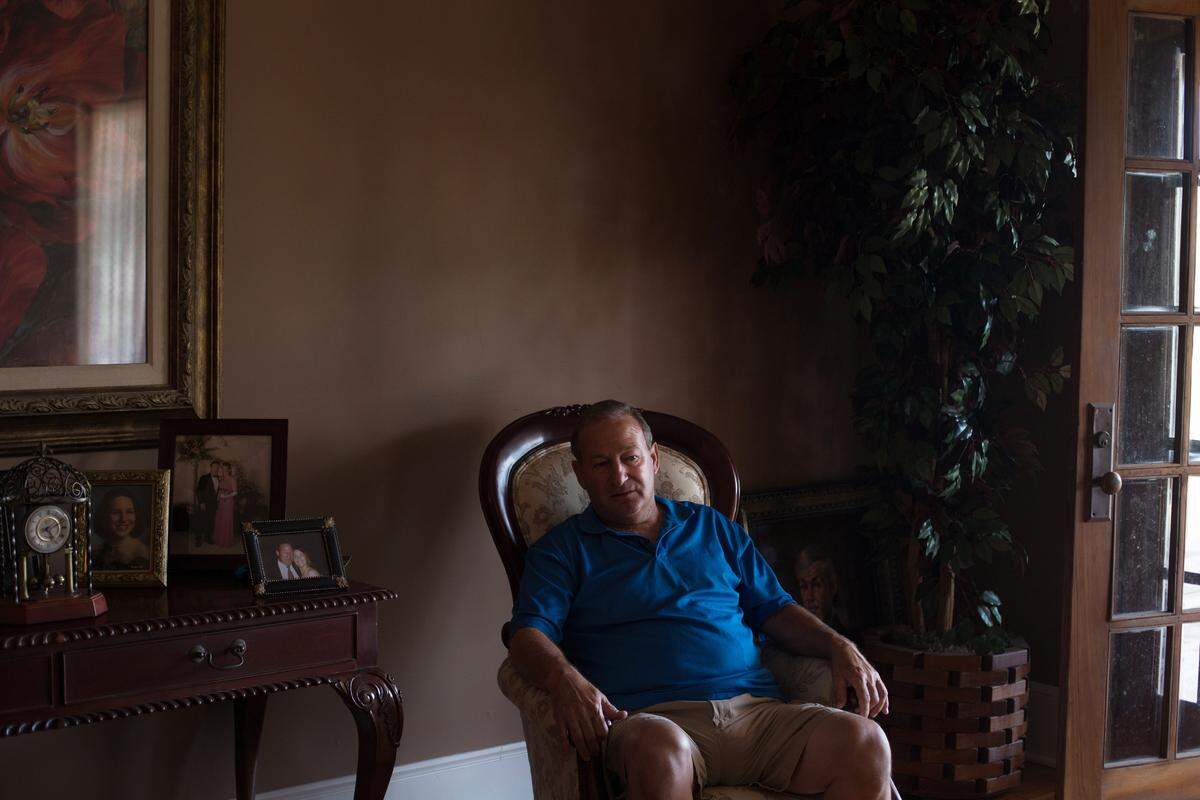 Michael Kovacevich sits in his home on Howard Avenue, one of the highest elevations in Point Cadet. As Hurricane Katrina raged around him, Kovacevich rescued numerous neighbors from high water and brought them to his home. “We had 23 people, five dogs, a cat and a parrot up there,” he said.