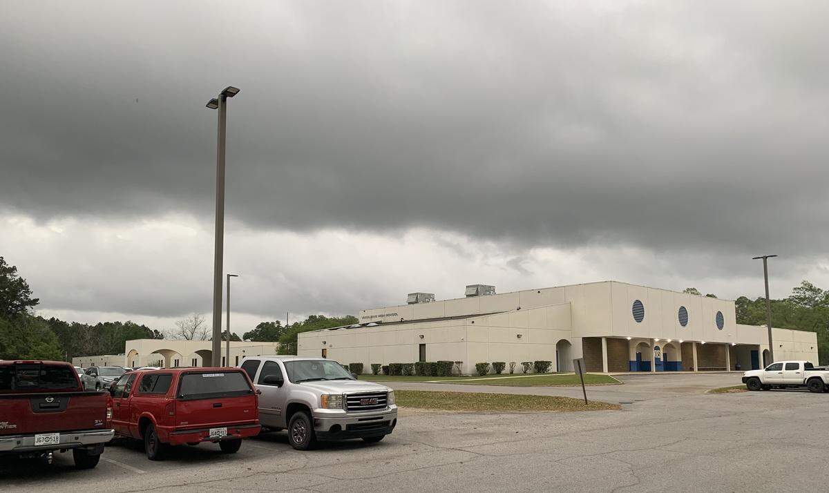A blanket of dark clouds sits over Vancleave High School.