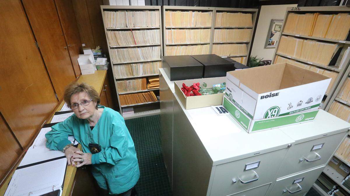 JOHN FITZHUGH/SUN HERALDJackson County Coroner Vicki Broadus stands in the room that used to be her office in the county's Amonett Street complex. Broadus now works from home and shares a desk with a secretary when she comes in. But for the first time in five years she has hope of getting room to talk with families when dealing with the county's dead..