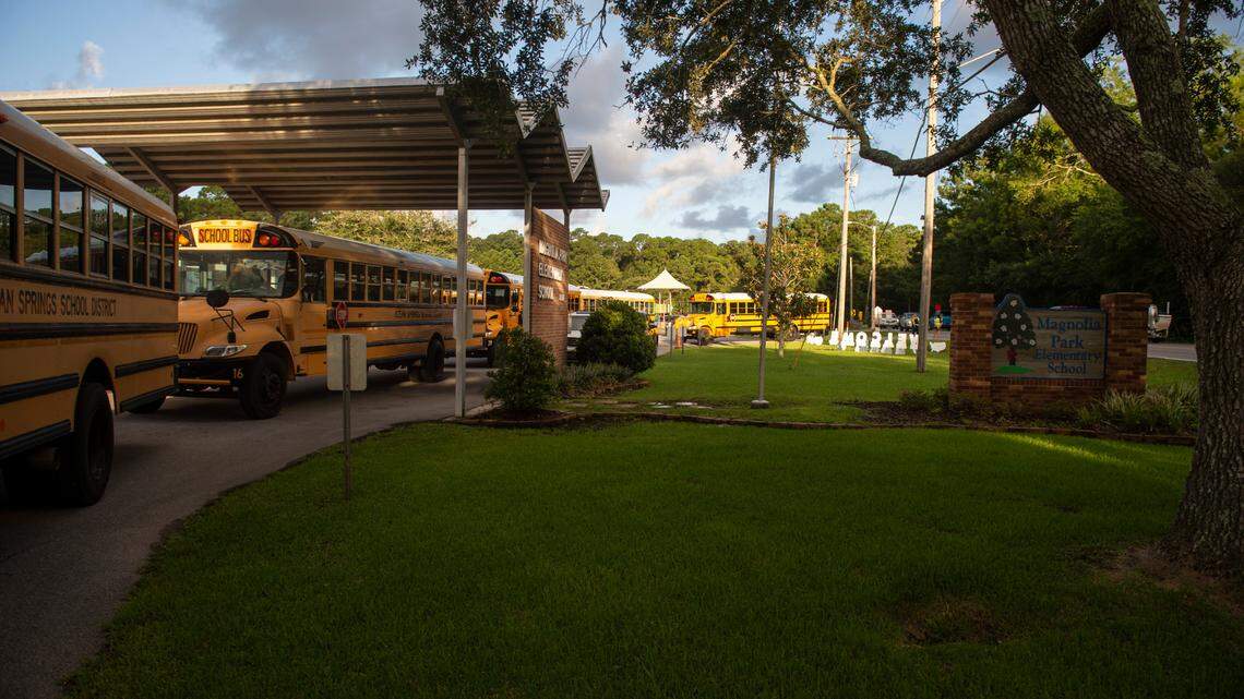 Buses line up outside Magnolia Park Elementary School before letting kids off on the first day of school in Ocean Springs on Friday, Aug. 5, 2022.