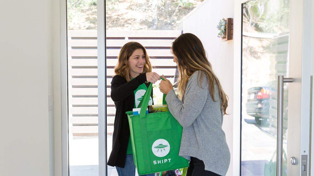 A Shipt shopper delivers groceries or other purchases within a window of an hour.