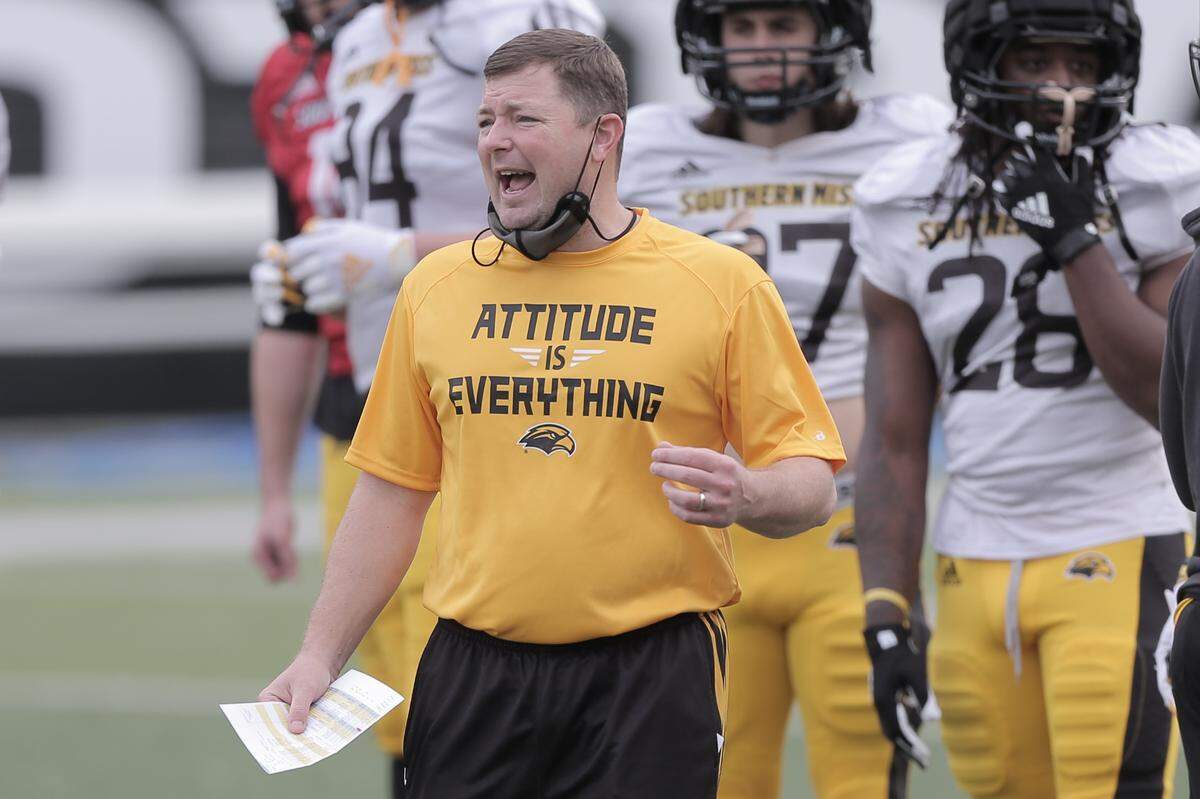 Head Coach Will Hall shouts during Southern Miss’s first football practice in full pads Saturday, February 27, 2021, at M.M. Roberts Stadium in Hattiesburg.