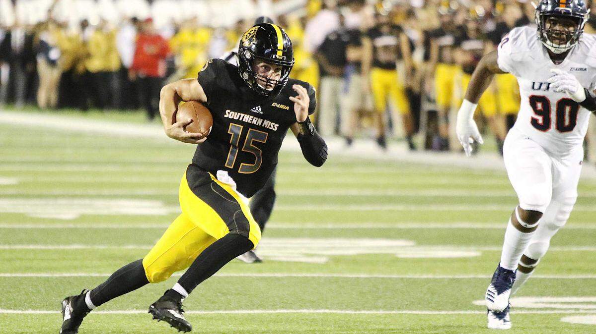 Southern Miss quarterback Jack Abraham scrambles for yardage against UTSA on Saturday at Roberts Stadium in Hattiesburg.