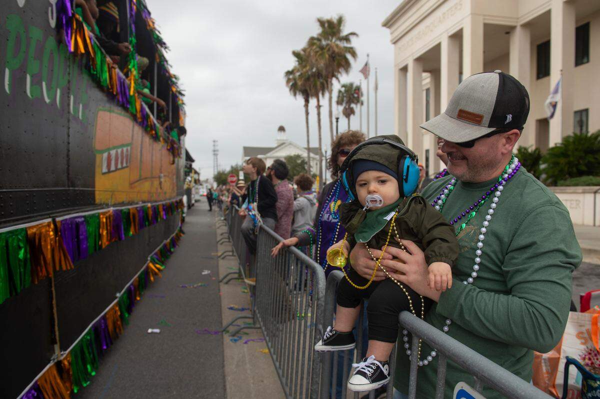 Paradegoers during the Krewe of Gemini parade in downtown Gulfport on Saturday, Feb. 10, 2024.