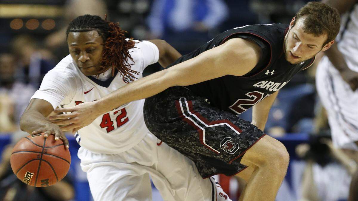 STEVE HELBER/ASSOCIATED PRESS 
 Ole Miss guard Stefan Moody (42) steals the ball from South Carolina forward Mindaugas Kacinas (25) during the second half of an NCAA college basketball game in the second round of the Southeastern Conference tournament, Thursday, March 12, 2015, in Nashville, Tenn.