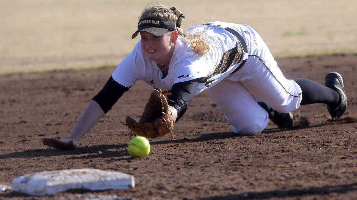 AMANDA McCOY/STAFF PHOTOGRAPHER 
 Southern Miss shortstop Mallory Hayden dives for a ground ball hit by Jackson State University during the Mississippi Gulf Coast softball Classic on Feb. 28, 2015.