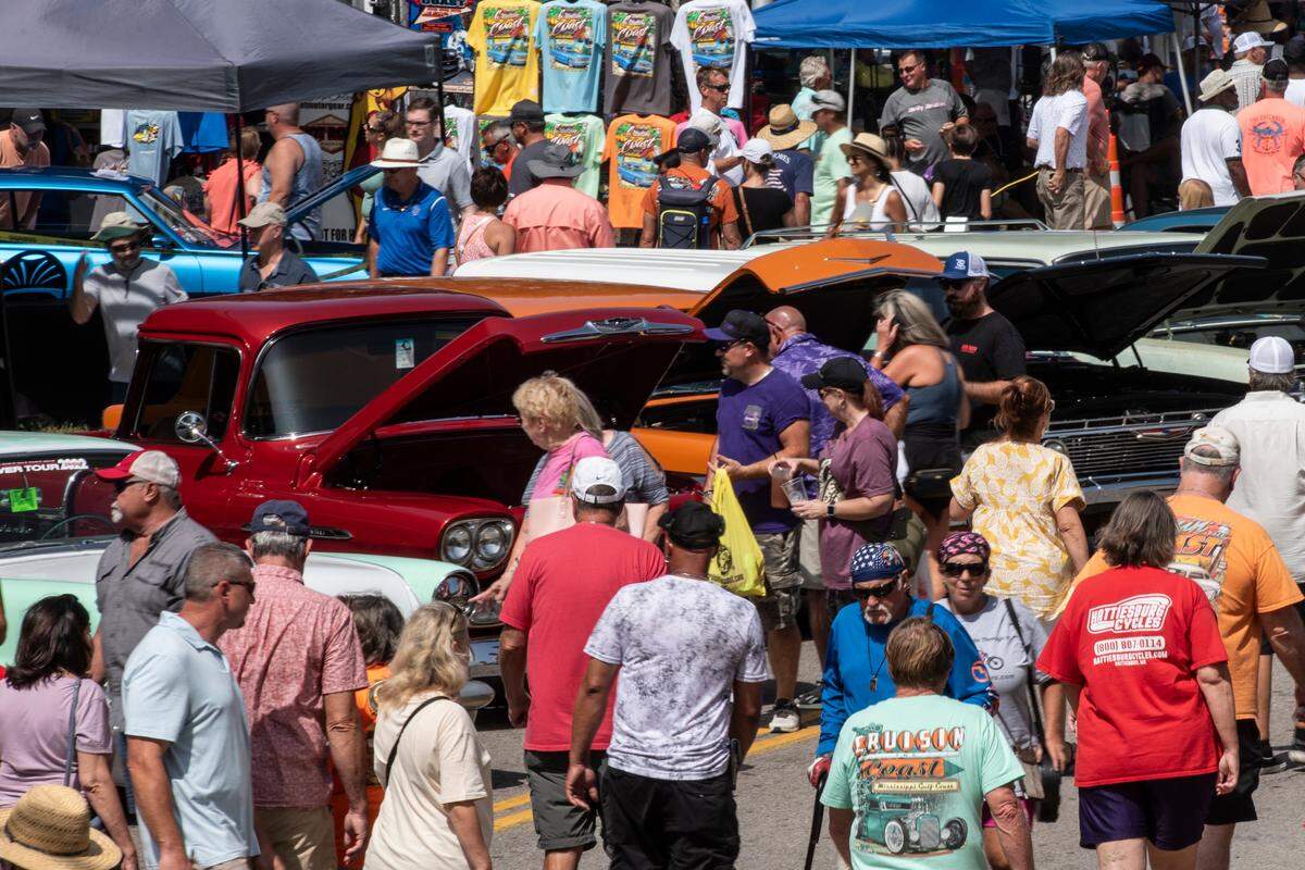 Spectators admire classic cars in downtown Biloxi during the 2023 Biloxi Block Party, one of many Cruisin’ the Coast events. More than 10,000 vehicles were registered for 2023’s Cruising’ the Coast.