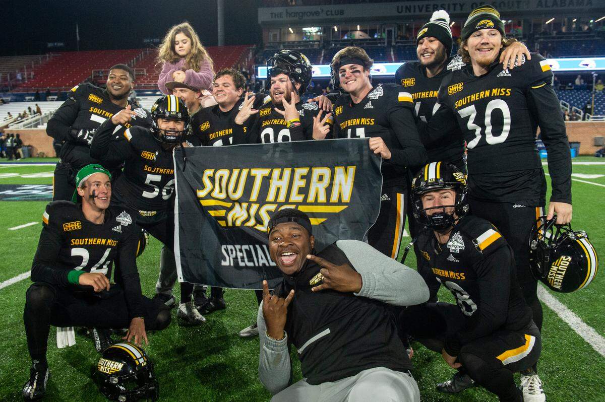 Southern Miss’ players celebrate after winning the Lending Tree Bowl at Hancock Whitney Stadium in Mobile, Alabama on Saturday, Dec. 17, 2022.