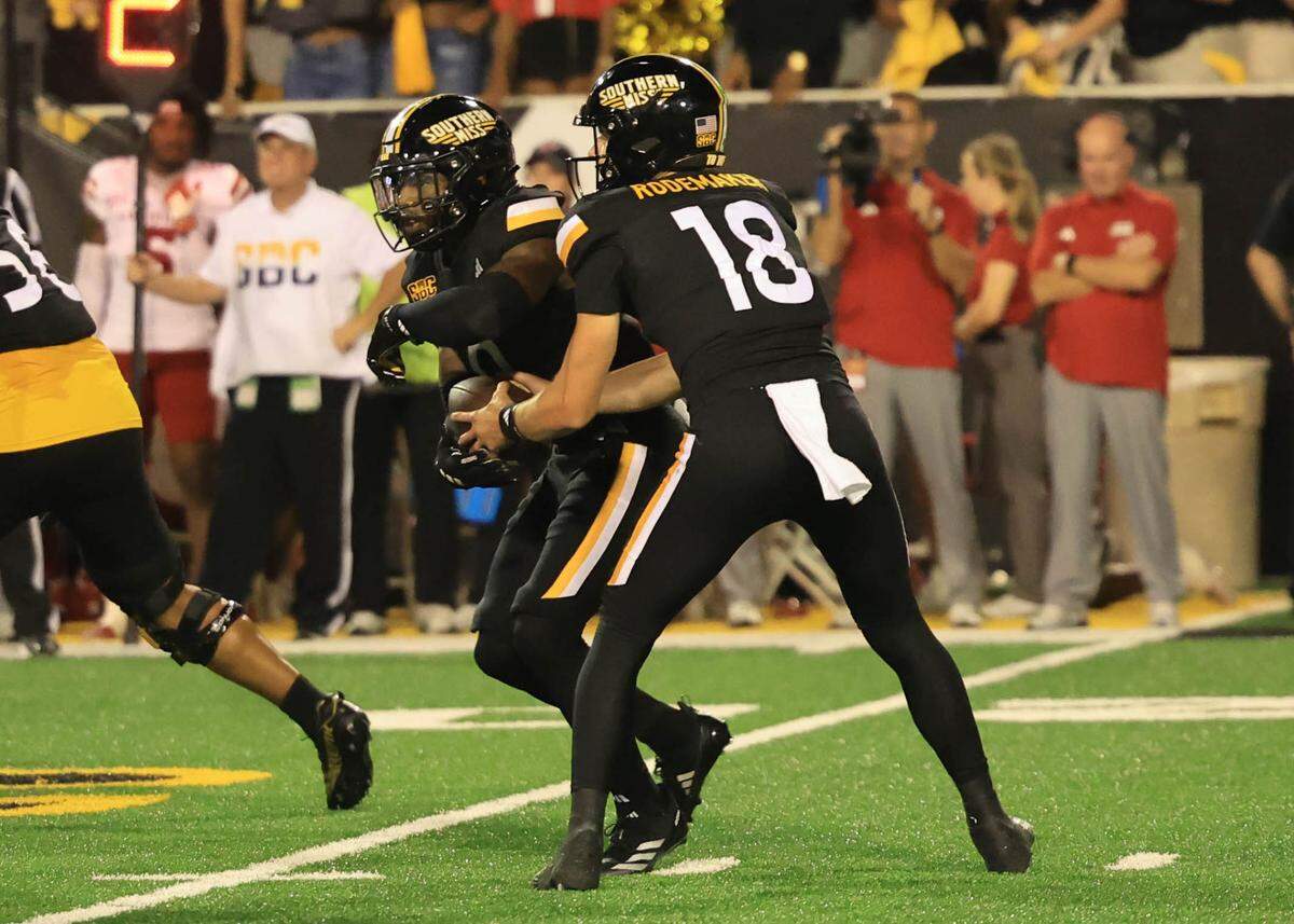 Southern Miss quarterback Tate Rodemaker (18) hands the ball off Saturday, Oct. 5, 2024, in the Golden Eagles’ loss to the Louisiana Ragin Cajuns.