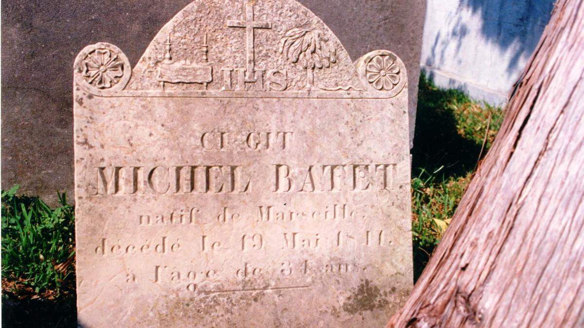COURTESY LOCAL HISTORY COLLECTION, BILOXI PUBLIC LIBRARYTime and the elements have practically obliterated the inscription on Michel Batet's tomb.