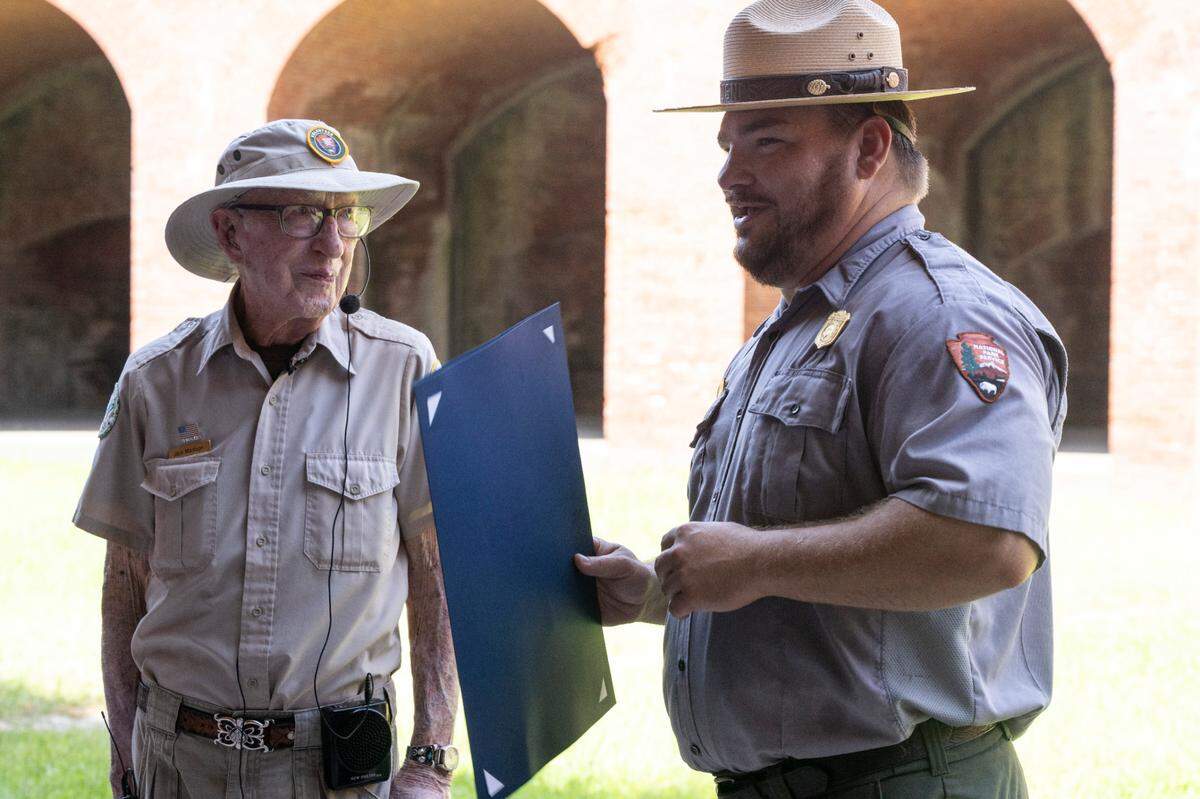 Jack Madison, a volunteer tour guide for Gulf Islands National Seashore, is presented with a City of Biloxi proclamation declaring July 11, 2025 — Madison’s 100th birthday — Jack Madison day.