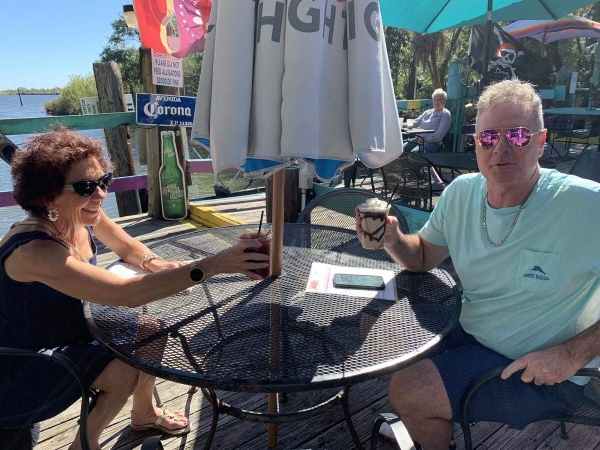 Making one last toast to Huck’s Cove in Gautier are Lisa Simpson and Jeffrey Saylors of Florida.