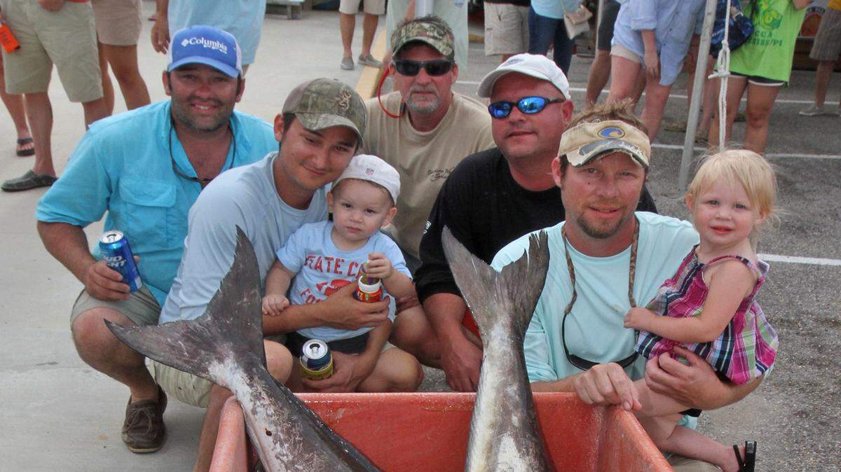 JOHN FITZHUGH/SUN HERALD 
 Members of the Sum Beach team pose with their 170.05-pound entry at Gorenflo's Cobia Tournament in Biloxi on Sunday April 26, 2015. From left are Chris Ryan, Mitchell Wieck, Ty Ferrell, David Lee and Ricky Noble.