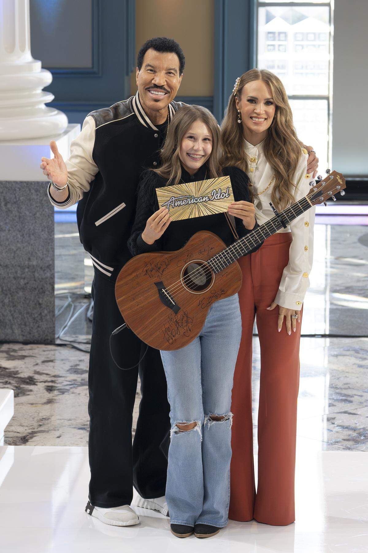 Khloe Grace advanced to the next round on American Idol after receiving yes votes from Lionel Richie (left), Carrie Underwood (right) and Luke Bryan.
