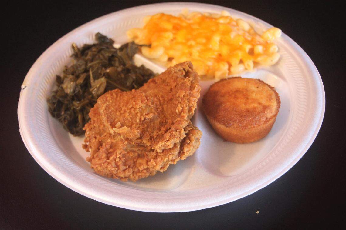 Fried chicken plate with mac and cheese and greens at Big Daddy’s soul food restaurant in Gulfport.