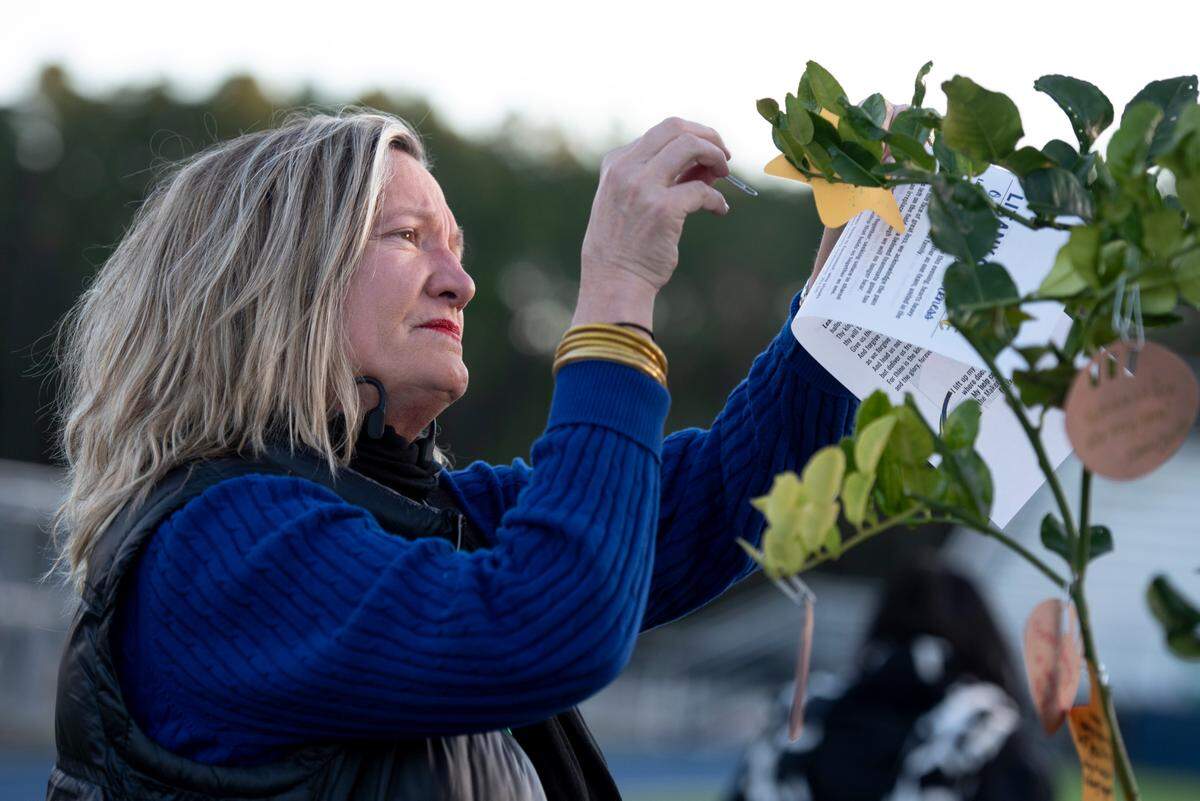 A mourner leaves a prayer on a prayer tree during a vigil for Gautier High School student Shermarion Miner at Gautier High School on Thursday, Jan. 16, 2025.