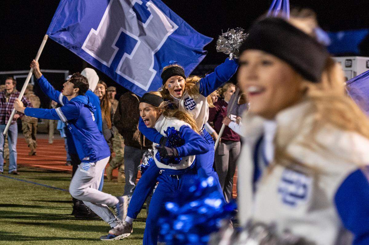 Ocean Springs cheerleaders celebrate after Ocean Springs won a 6A playoff game against Oak Grove at Greyhound Stadium in Ocean Springs on Friday, Nov. 18, 2022.