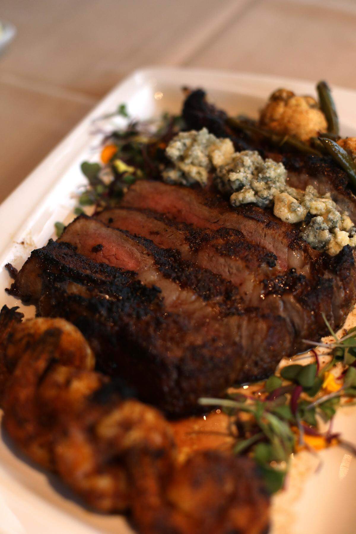 The cowboy ribeye with blue cheese and blackened shrimp at Blue Bayou inside Silver Slipper Casino in Hancock County.