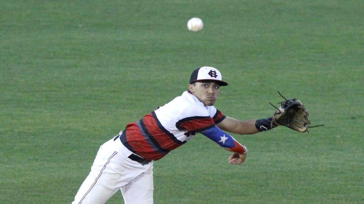 TIM ISBELL/SUN HERALD 
 Harrison Central shortstop Ian Colon throws to first after fielding a ground ball against Hancock, Thursday, March 31, 2016.