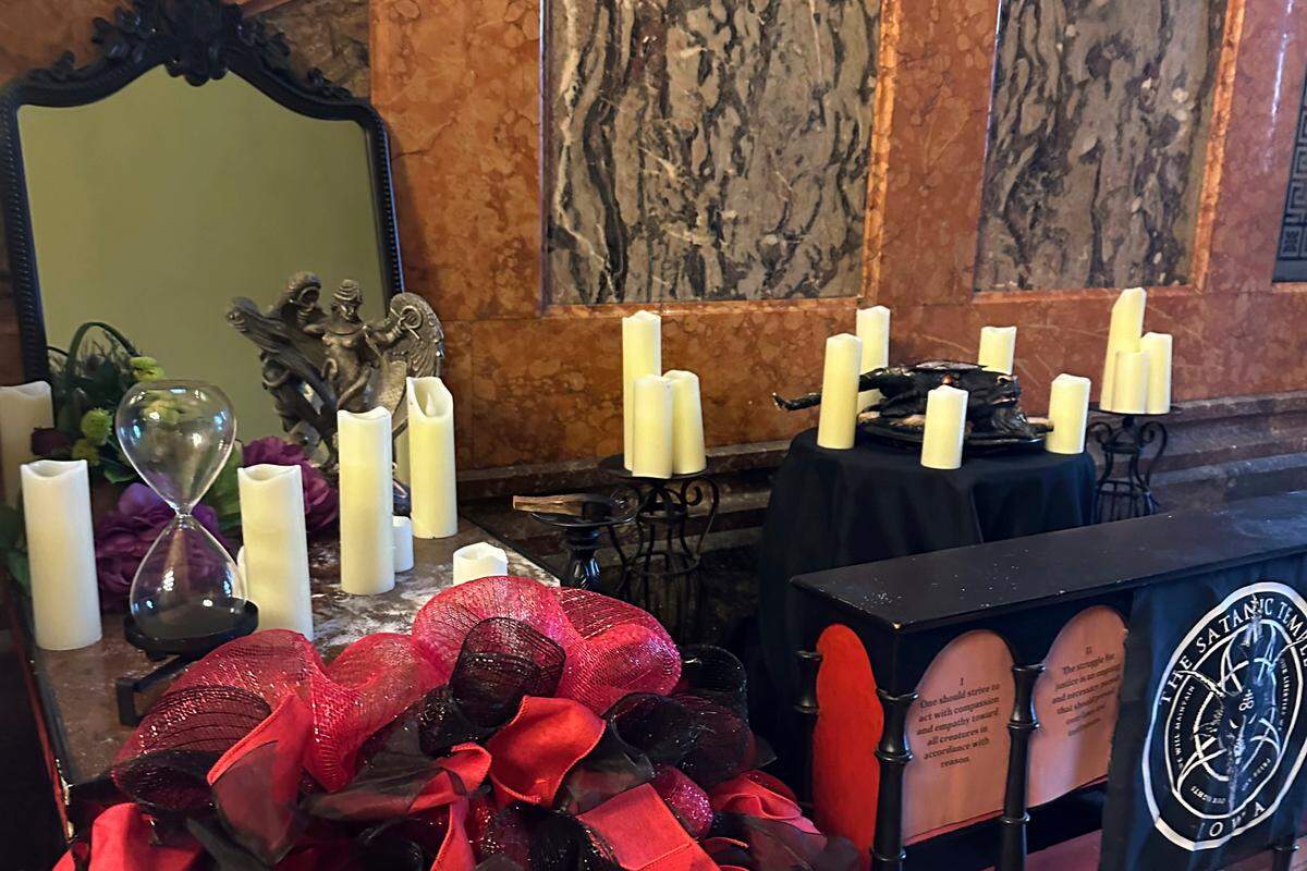 A damaged Satanic display is shown at the Iowa state Capitol on Friday, Dec. 15, 2023, in Des Moines, Iowa. The display, which has prompted outrage by some people who say it’s inappropriate at any time but especially during the Christmas holidays, was damaged Thursday.    (AP Photo/Scott McFetridge)  