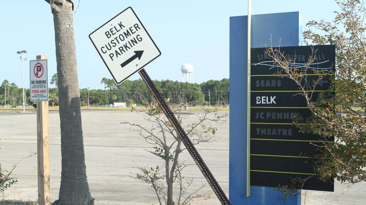 The parking lot at the former Singing River Mall is part of the acreage the city is developing as a Town Center. Signs for the old mall stores remain, although Belk is the only one still operating. A hotel developer has signed a deal with the city to build a Marriott or Hilton hotel on a portion of the 55 acres that the city owns.