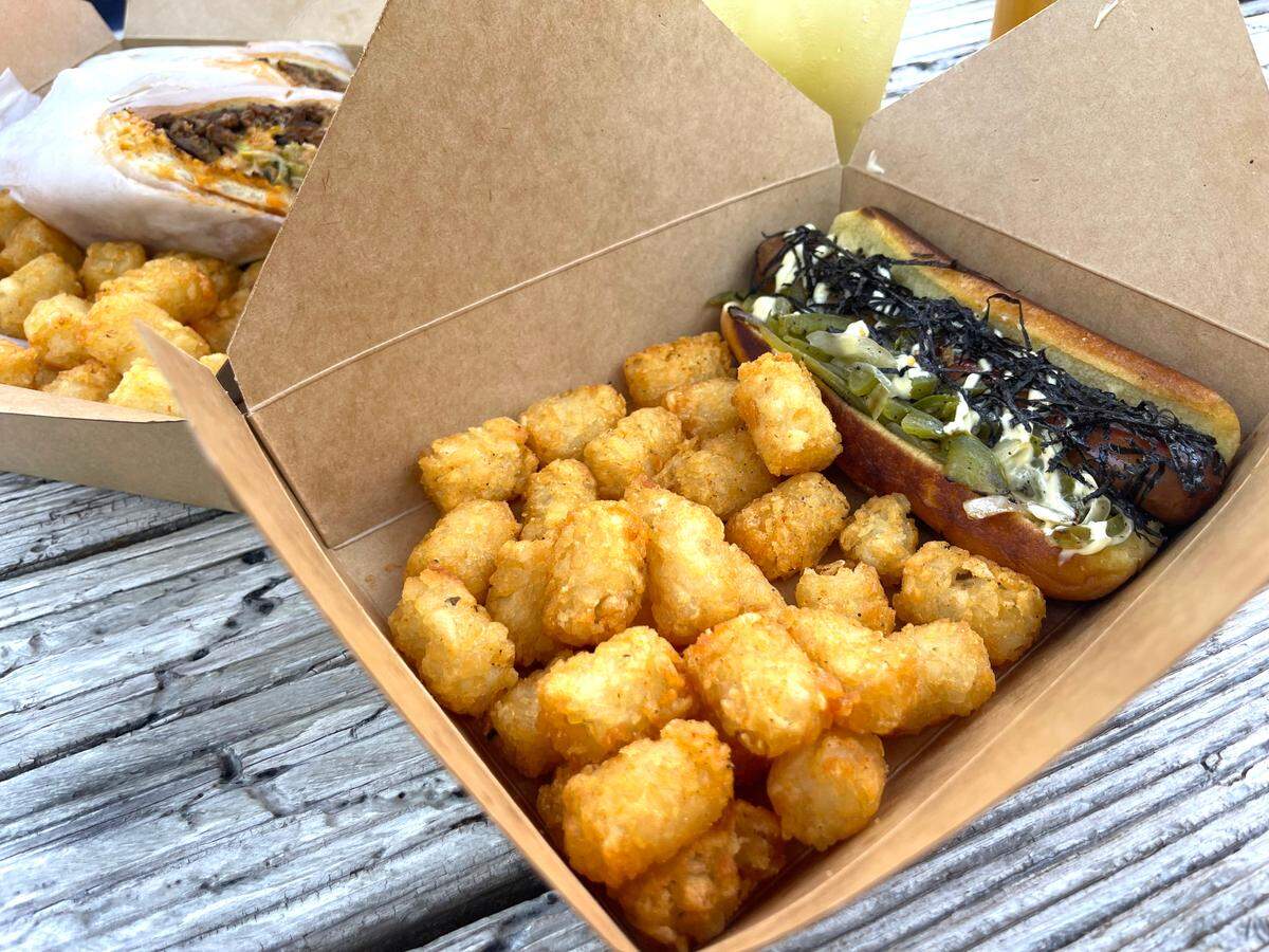 The Japanese Glizzy at Hungry Homiez food truck in St. Martin is a beef hot dug on a Hawaiian bun topped with sauteed onions and bell peppers, teriyaki sauce, mayo and nori flakes.