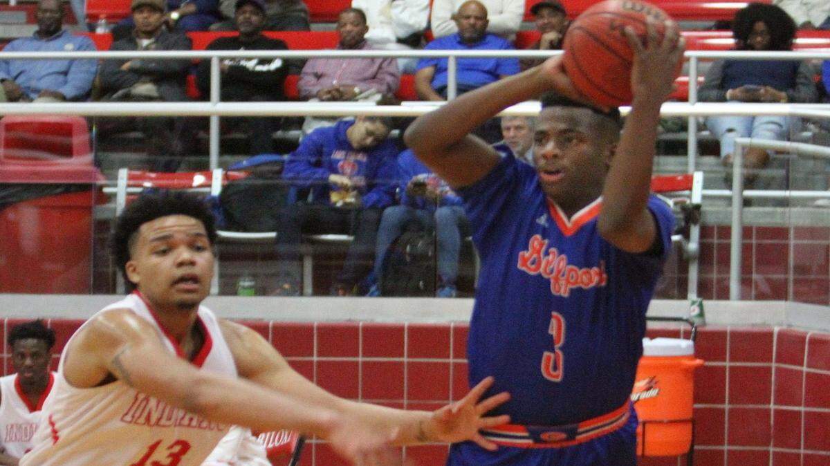 JOHN FITZHUGH/SUN HERALD 
 Gulfport's Joshua Green makes a pass on the baseline against Biloxi's Fred Ramsey-Thompson during the first half of their game at Biloxi on Friday Jan. 22, 2015.
