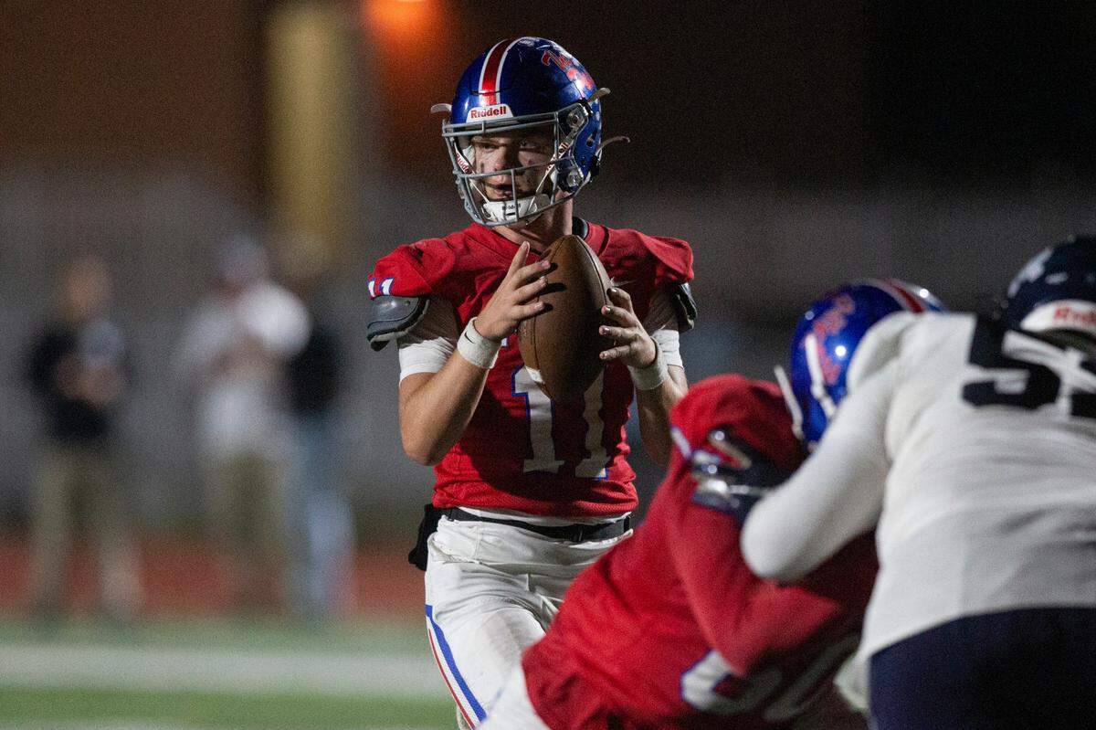 Pass Christian quarterback Ladd Scriber prepares to throw a pass during a game against Moss Point at Pass Christian High School in Pass Christian on Friday, Oct. 13, 2023.