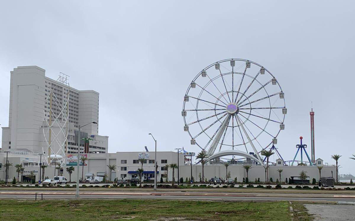 The Observation Wheel and the Aerobar to the left are two of 15 rides at the new Paradise Pier Fun Park opening soon at Margaritaville Resort Biloxi.