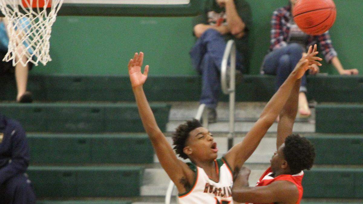 JOHN FITZHUGH/SUN HERALDWest Harrison's Drelon Pittman blocks a shot by  Biloxi's Jaylon Chiles during the first quarter of their game at West Harrison on Tuesday Nov. 16, 2015.