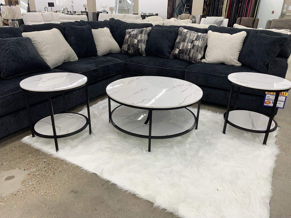 A black sectional with contrasting accessories is one of the modern looks available at the new Furniture City store in Biloxi.