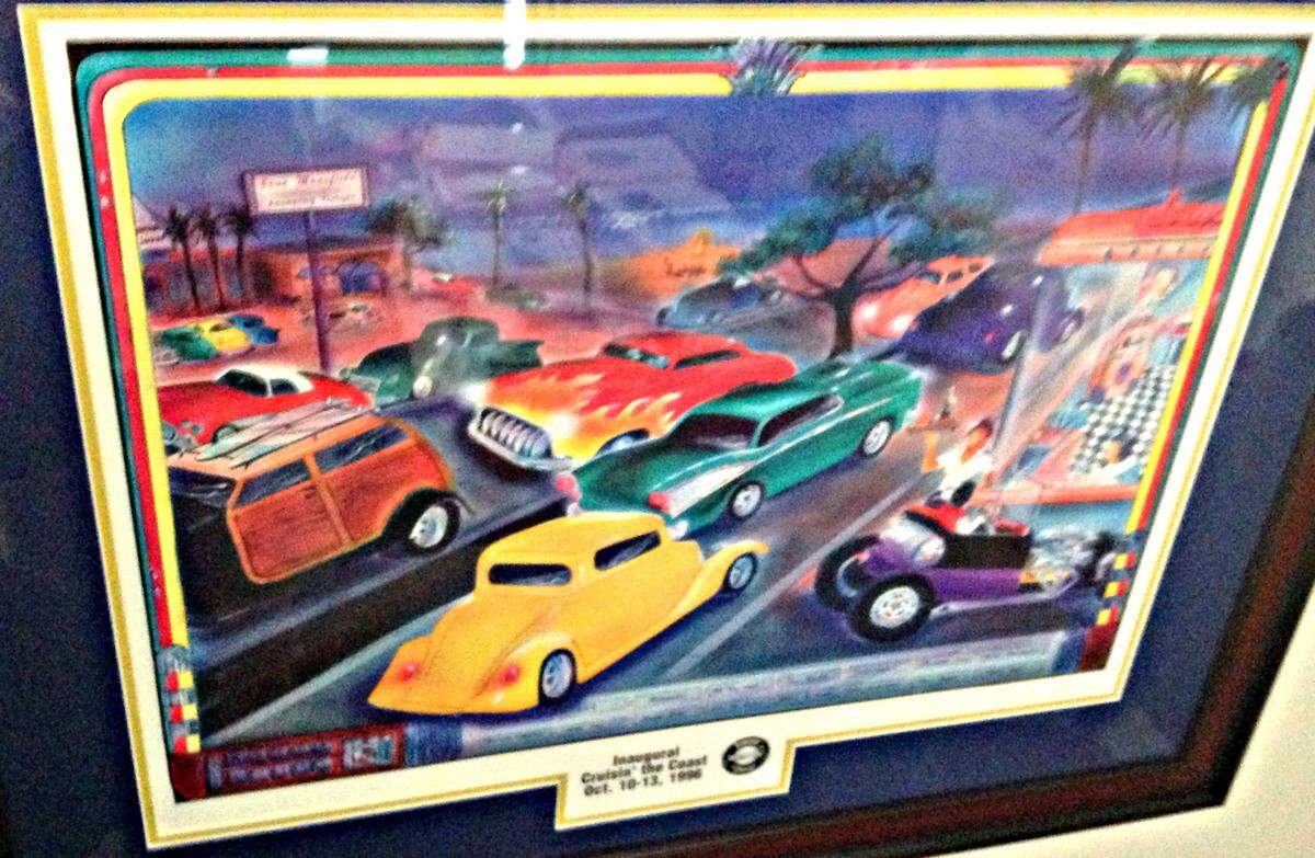 The first poster for the inaugural Cruisin' The Coast on 1996 hangs in the office of executive director Woody Bailey. A poster has been created for all 29 years.