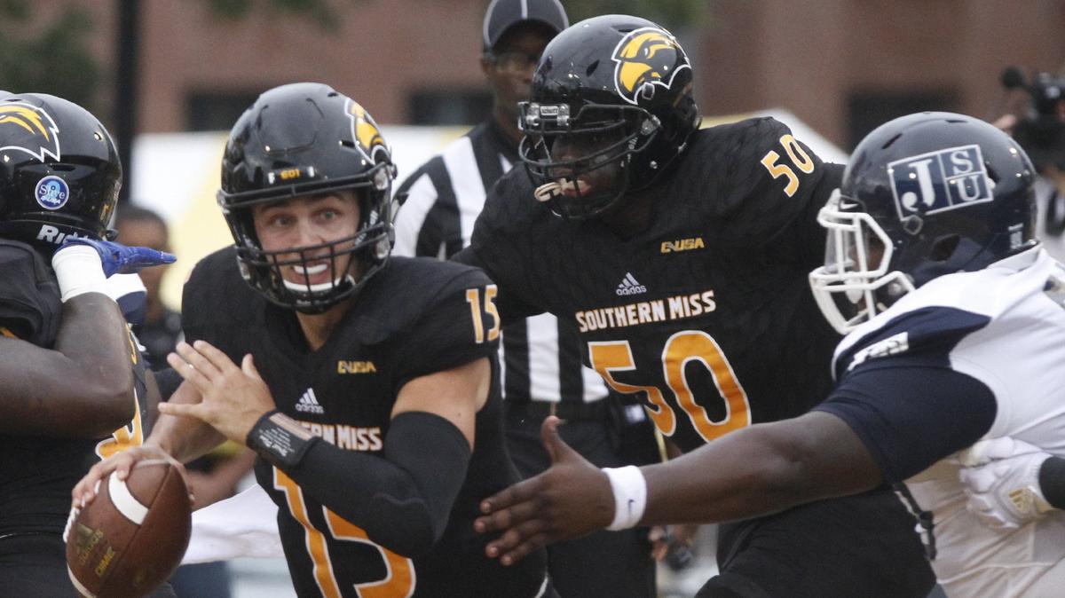 Southern Miss quarterback Jack Abraham scrambles before making a pass against Jackson State during the first quarter of their game at M.M. Roberts Stadium in Hattiesburg on Sept. 1