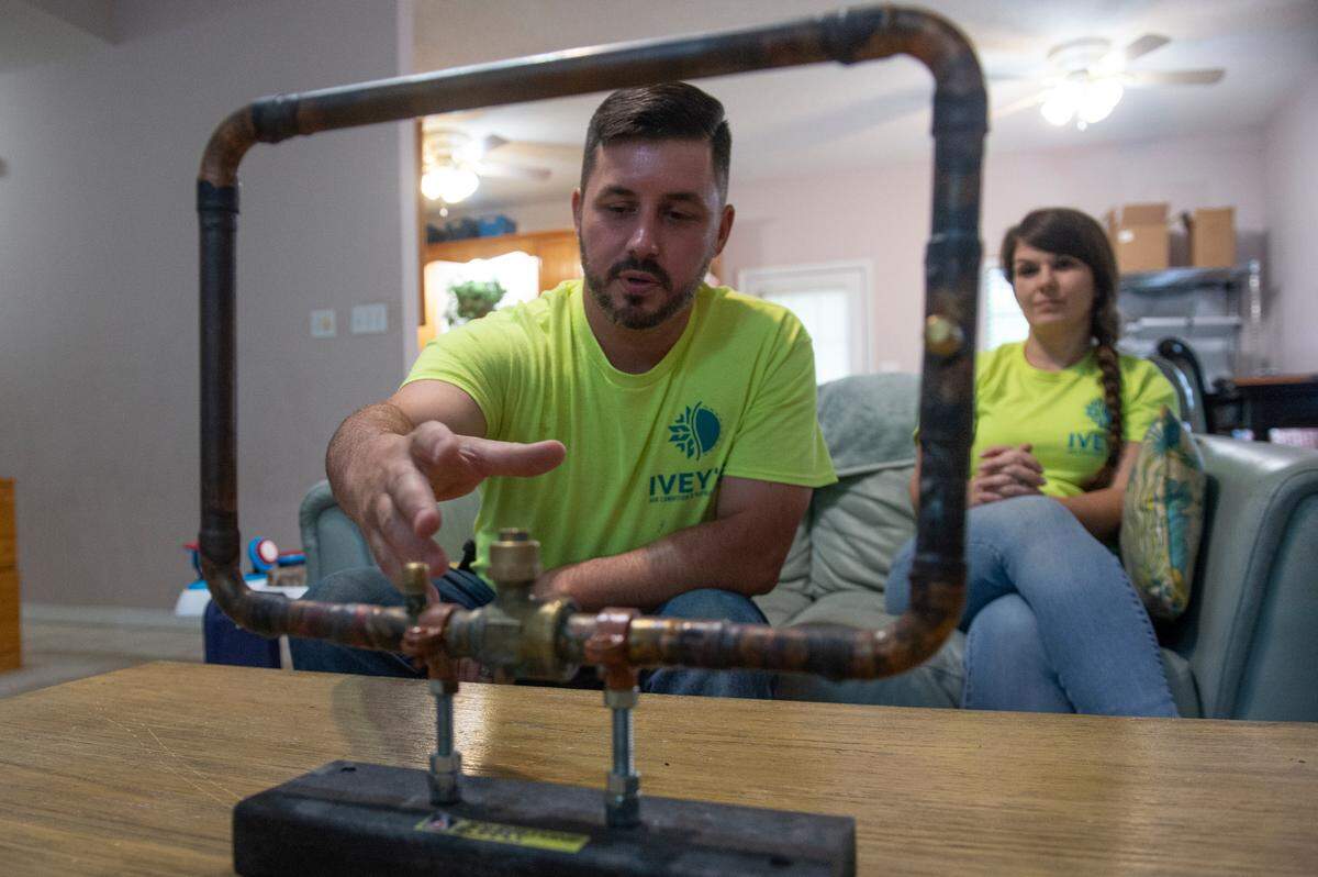 An HVAC test that he completed sits on a table as Alex Ivey, owner of Ivey’s Air Condition and Refrigeration, is interviewed at his home in Ocean Springs on Wednesday, Sept. 4, 2024. Ivey had to complete the test, which included brazing the parts together, to become a finalist in the HVAC National Championship, which will air on CBS Sports.