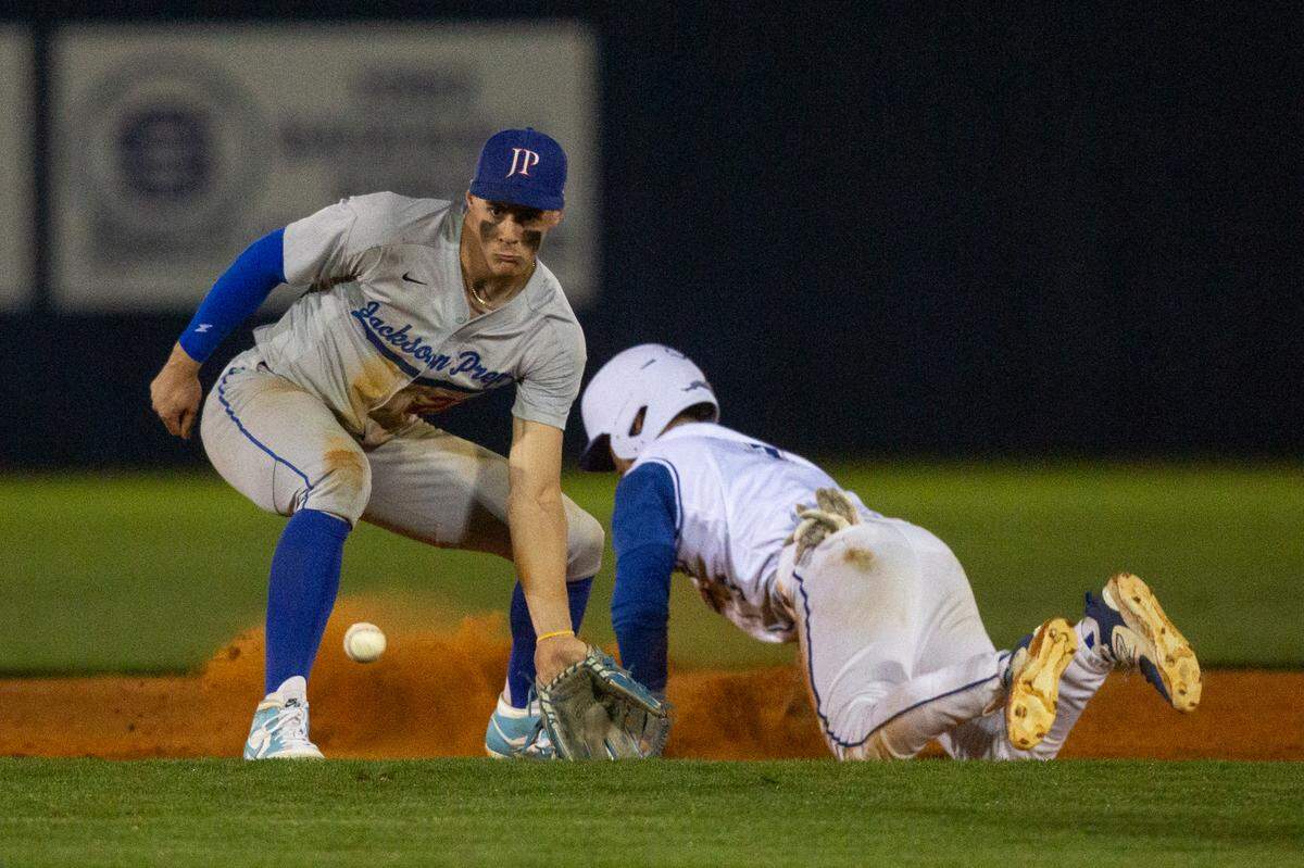 Jackson Prep’s Konnor Griffin catches a ball at second base as Ocean Springs’ Chris Fox slides onto base during a game in Ocean Springs on Monday, March 11, 2024.