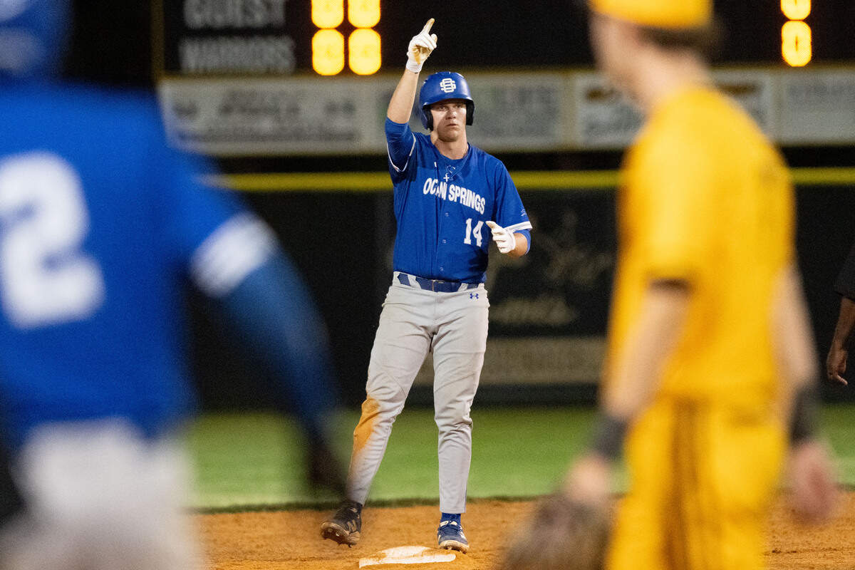 Ocean Springs’ Adam Clower (14) celebrates a hit Friday against D’Iberville.