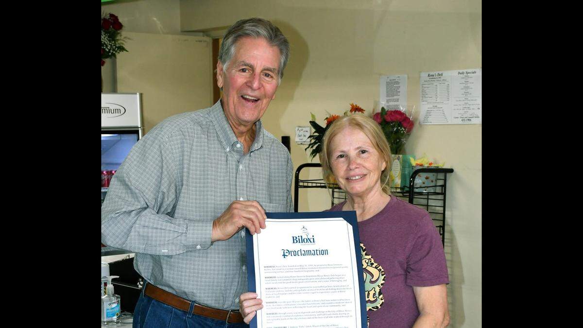 Biloxi Mayor Andrew “FoFo” Gilich honors Rena Simmons with a proclamation for the 35 years she operated Rena’s Deli in downtown Biloxi. The sandwich shop on Lameuse Street has closed.