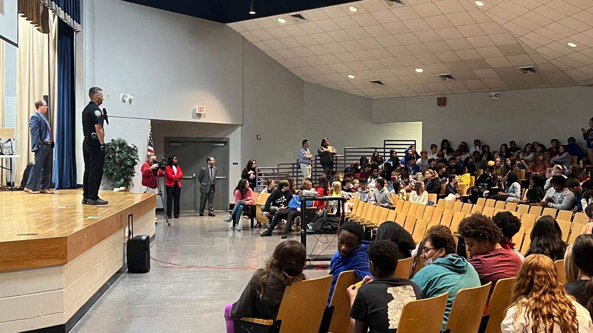 Gulfport Police Chief Adam Cooper and District Attorney Crosby Parker address students at Bayou View Middle School.