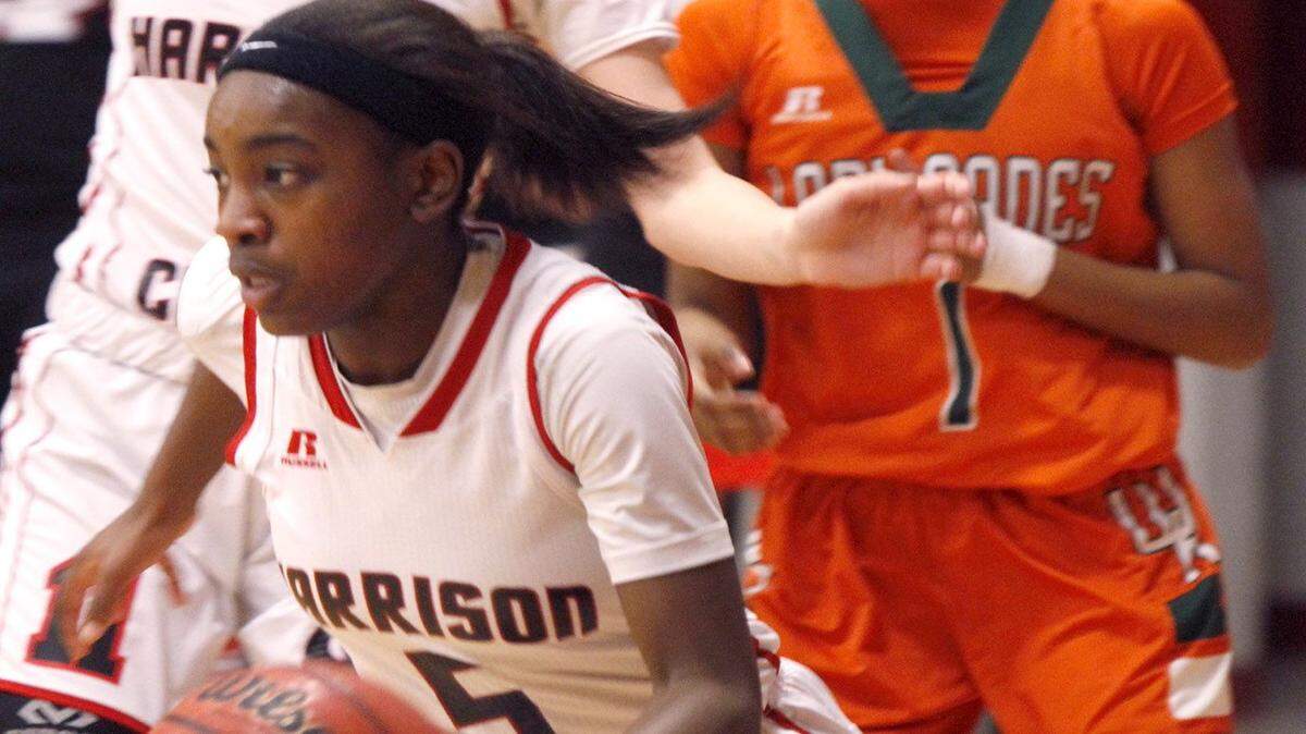 TIM ISBELL/SUN HERALD 
 Harrison Central's Chyna Allen pushes the ball up court after grabbing a defensive rebound against West Harrison, Tuesday, Feb. 2, 2016.