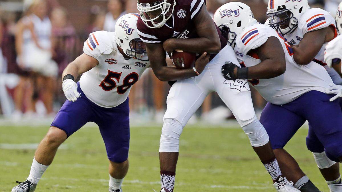 Mississippi State quarterback Elijah Staley (2) is tackled after a short run by a number of Northwestern State defenders including linebacker Paxton Cook (58) during the second half of an NCAA college football game, Saturday, Sept. 19, 2015 in Starkville, Miss. Mississippi State won 62-13. (AP Photo/Rogelio V. Solis)