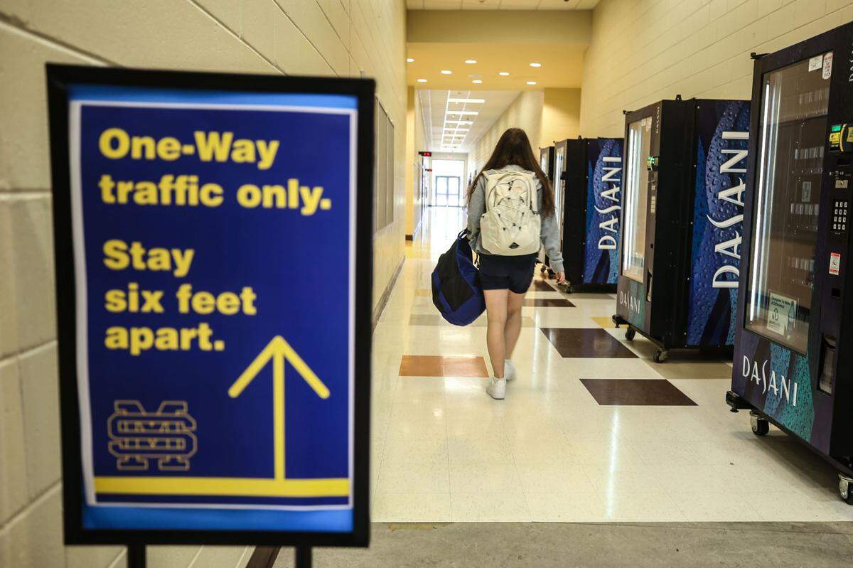Students walk the halls clockwise between classes to help maintain social distancing as much as possible. The school put up one-way signs and staggered student dismissal.