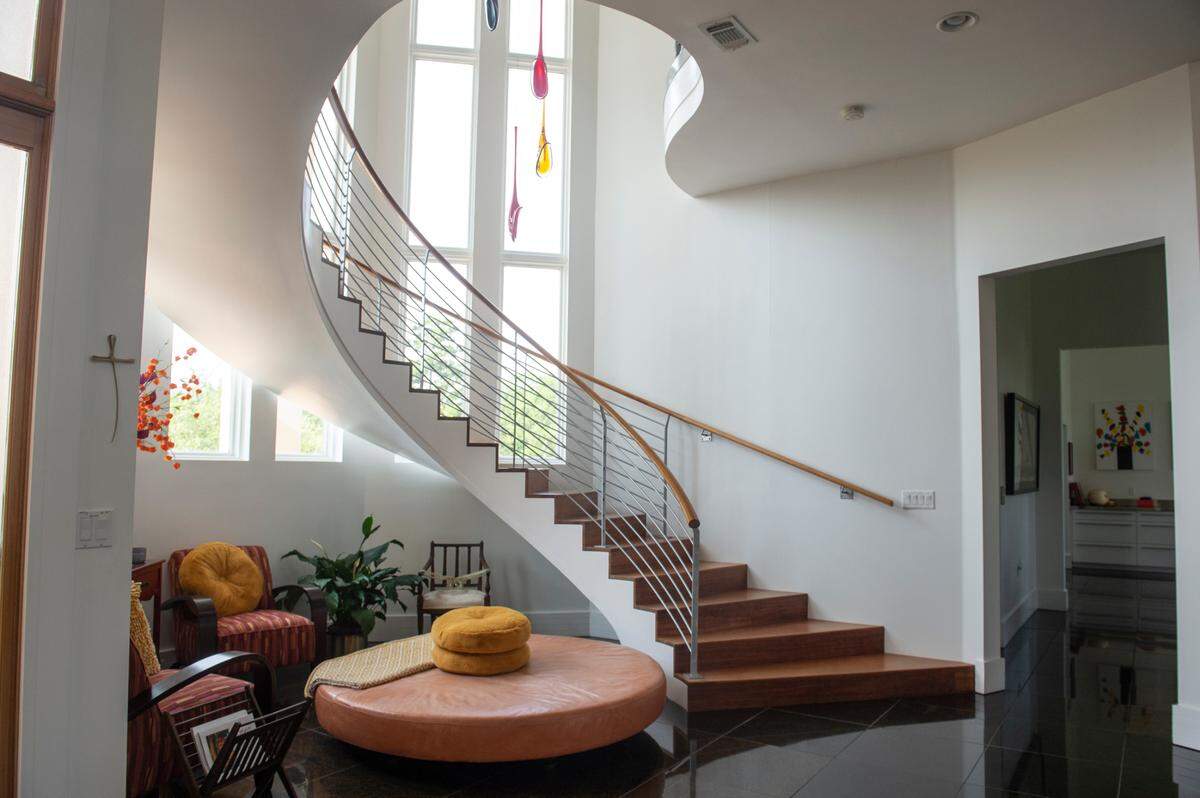 The main staircase inside a house for sale off of Rue Rivage in Ocean Springs on Friday, June 9, 2023.