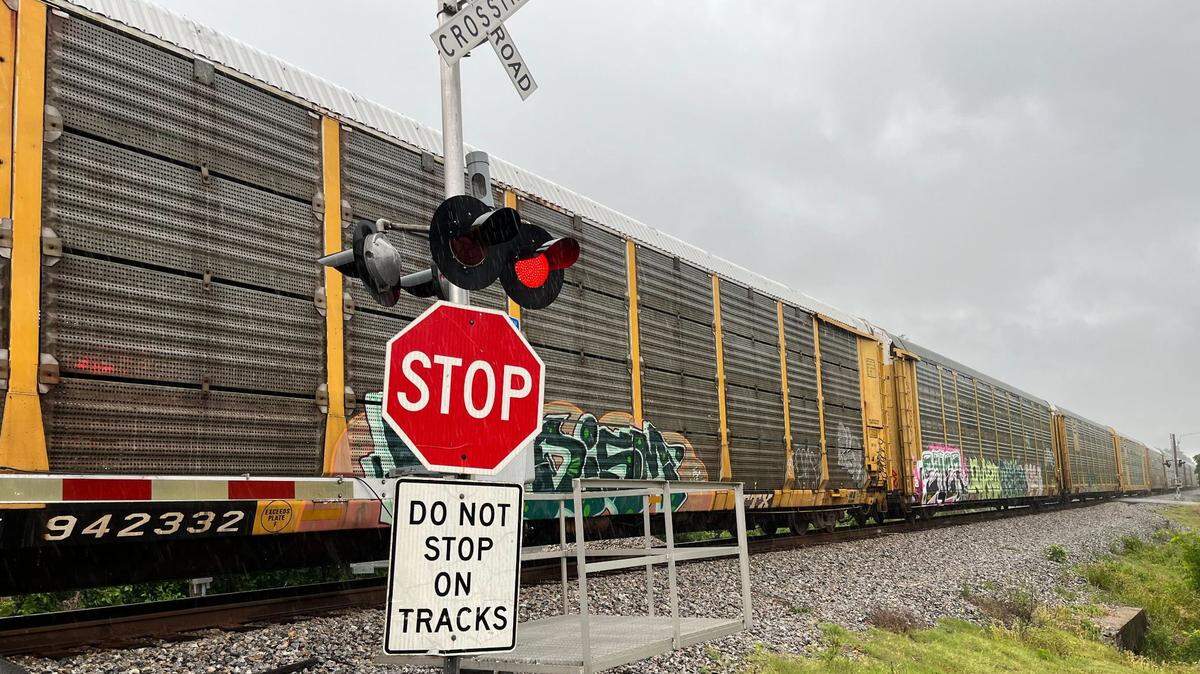 A train is stopped on the tracks in Biloxi after a pedestrian was struck Monday.