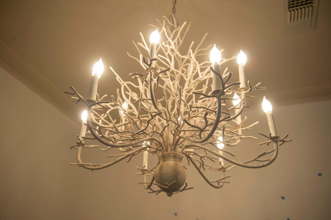 A chandelier hangs in one of the rooms at The Springs Hotel under construction in Ocean Springs on Monday, Nov. 20, 2023.