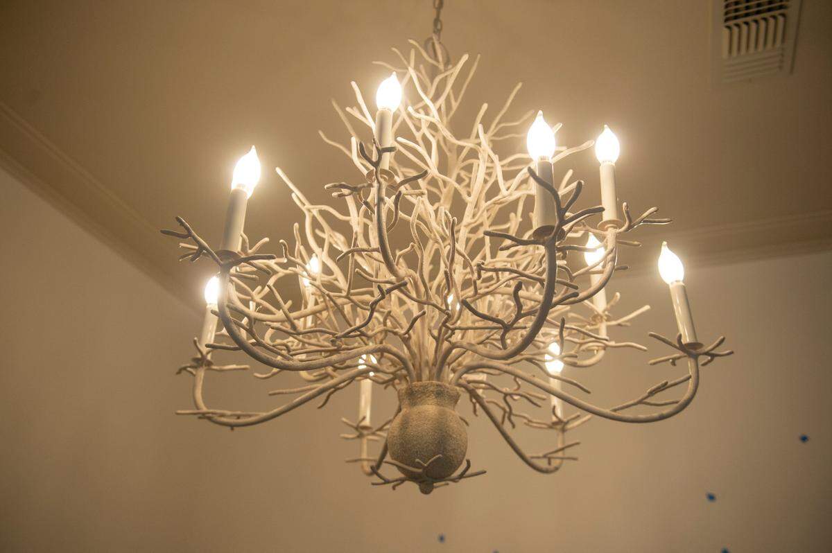 A chandelier hangs in one of the rooms at The Springs Hotel under construction in Ocean Springs on Monday, Nov. 20, 2023.