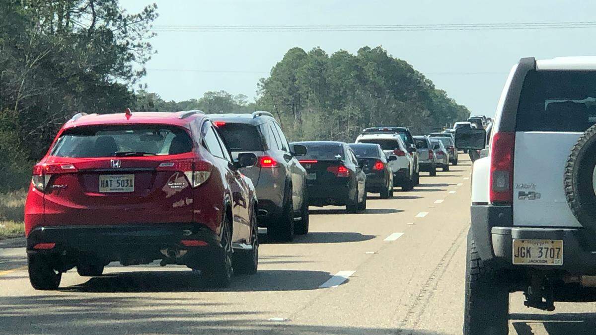 Traffic backs up on Interstate 10 near the Louisiana-Mississippi state line. Scenes like this will likely be commonplace this weekend across the Gulf Coast.