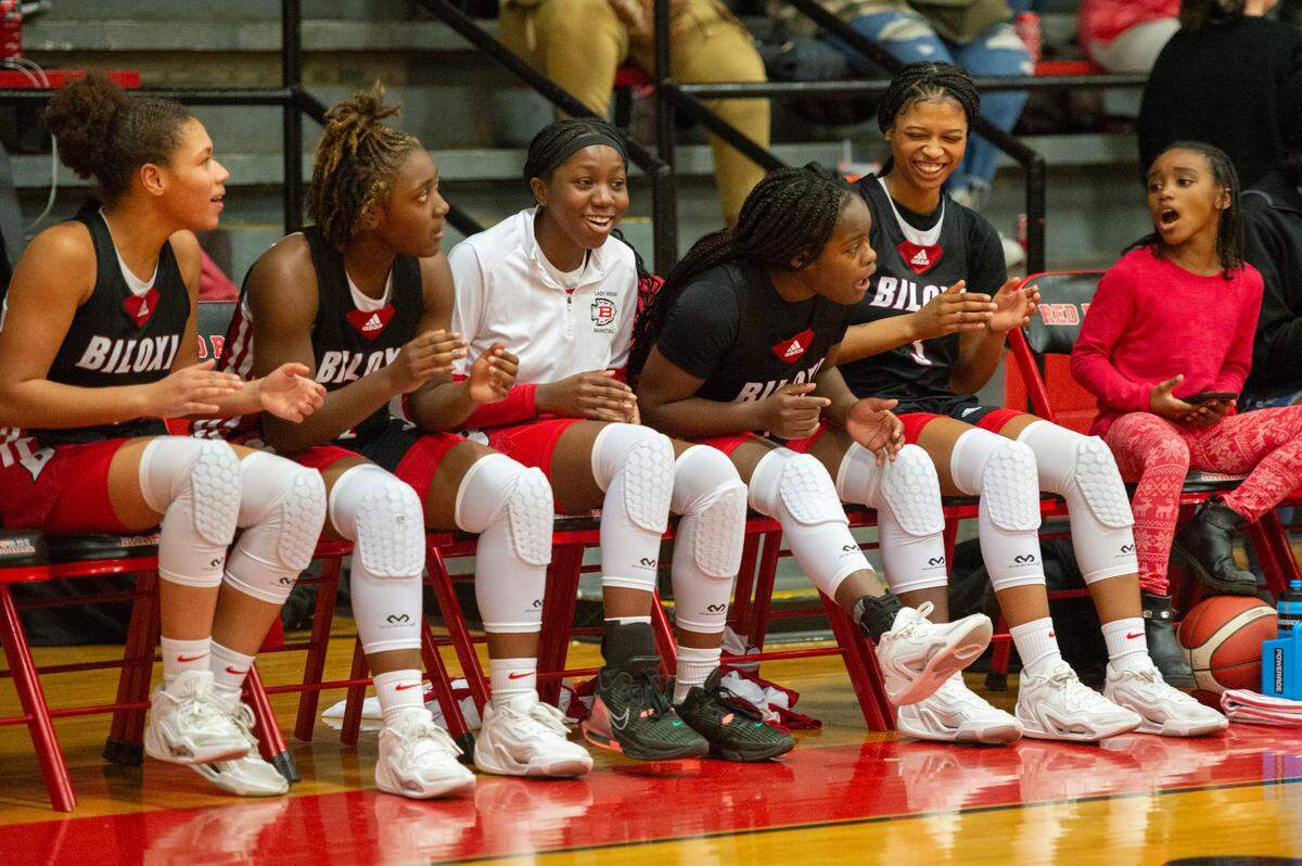 The Bilox bench cheers for their teammates earlier this year during a game against Harrison Central.